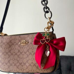 Bag strap extender, cherry purse charm, red bow charm